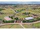 This aerial view shows the horse property, detached garages, and surrounding acreage at 10325 Cherrywood Dr, Parker, CO 80138