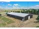 Large barn with a white roof, visible against a scenic landscape at 10325 Cherrywood Dr, Parker, CO 80138