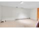 Spacious unfinished basement with tile flooring and a door leading to the outside at 10325 Cherrywood Dr, Parker, CO 80138