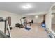 Finished basement space, ideal for a home gym or recreational area with tile flooring at 10325 Cherrywood Dr, Parker, CO 80138