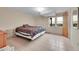 Bedroom with tile floors, large window, ample natural light and neutral walls at 10325 Cherrywood Dr, Parker, CO 80138