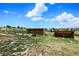 View of outdoor corrals and shelters on a grassy plot, perfect for livestock at 10325 Cherrywood Dr, Parker, CO 80138