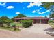 Lovely brick home with a spacious driveway and attached garage at 10325 Cherrywood Dr, Parker, CO 80138