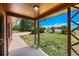 Covered front porch offers peaceful views of the property at 10325 Cherrywood Dr, Parker, CO 80138