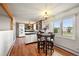 Open kitchen features stainless steel appliances, a kitchen island, and a sunny breakfast nook at 10325 Cherrywood Dr, Parker, CO 80138
