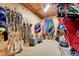 Organized tack room with wooden walls and ample storage for equestrian equipment at 10325 Cherrywood Dr, Parker, CO 80138