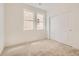 Bedroom featuring carpet, neutral walls, closet with sliding doors, and bright windows at 13826 Honey Hush Trl, Parker, CO 80134