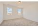 Bright bedroom with carpet, two windows with great views, and neutral walls at 13826 Honey Hush Trl, Parker, CO 80134