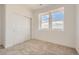 Bedroom with carpet, and a closet with sliding doors, and bright natural light at 13826 Honey Hush Trl, Parker, CO 80134