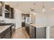 Kitchen features wood floors, stainless steel appliances, granite countertops, and dark cabinetry at 13826 Honey Hush Trl, Parker, CO 80134