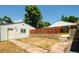 The property includes a detached garage and a backyard patio with potential for landscaping at 3519 Newton St, Denver, CO 80211