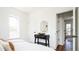 Tastefully decorated bedroom featuring modern decor, wood floors, and natural light at 3519 Newton St, Denver, CO 80211