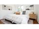 Bright bedroom with a comfortable bed, neutral decor, and two side tables at 3519 Newton St, Denver, CO 80211