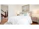 Comfortable bedroom with large window, hardwood floors, and calming decor at 3519 Newton St, Denver, CO 80211