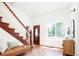 Inviting entryway with hardwood floors, staircase, and ample natural light at 3519 Newton St, Denver, CO 80211