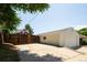 A detached one car garage with a concrete driveway and a fenced yard at 3519 Newton St, Denver, CO 80211