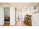 Inviting hallway with hardwood floors and views of dining and living spaces at 3519 Newton St, Denver, CO 80211