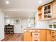 Bright kitchen showcasing wood cabinets, breakfast bar and quartz countertops at 3519 Newton St, Denver, CO 80211
