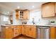 Bright kitchen showcasing wood cabinets, stainless steel appliances and quartz countertops at 3519 Newton St, Denver, CO 80211