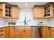 Charming kitchen featuring wooden cabinets, quartz countertop, stainless steel appliances and lots of natural light at 3519 Newton St, Denver, CO 80211