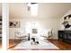Bright living room with skylight, hardwood floors, stylish seating, and modern decor at 3519 Newton St, Denver, CO 80211