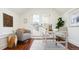 Bright home office with desk, comfortable chair, wood floor, and access to a balcony at 3519 Newton St, Denver, CO 80211
