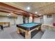 Finished basement featuring a game area with a pool table and wood plank ceiling at 8427 Chase Dr, Arvada, CO 80003