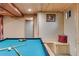 Finished basement featuring a pool table, and wood plank ceiling at 8427 Chase Dr, Arvada, CO 80003
