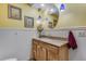 Charming bathroom featuring wainscoting, granite countertop vanity, and decorative pendant lighting at 8427 Chase Dr, Arvada, CO 80003