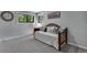 Serene bedroom featuring comfortable bedding, decorative pillows, and two windows for natural light at 8427 Chase Dr, Arvada, CO 80003