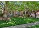 Charming home with a well-maintained lawn, mature trees, and a cozy front porch at 8427 Chase Dr, Arvada, CO 80003