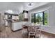 Cozy kitchen with eat-in area, bay window, and lots of natural light at 8427 Chase Dr, Arvada, CO 80003