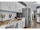 Bright kitchen featuring stainless steel refrigerator and a convenient workstation at 8427 Chase Dr, Arvada, CO 80003