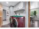 Convenient laundry area adjacent to breakfast nook with modern appliances at 8427 Chase Dr, Arvada, CO 80003