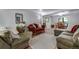 Comfortable living room with plush seating, hardwood floors, and ample natural light at 8427 Chase Dr, Arvada, CO 80003