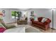 Bright living room featuring hardwood floors, comfortable seating, and stylish decor at 8427 Chase Dr, Arvada, CO 80003