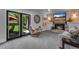 Inviting living room with fireplace, backyard access, and comfortable seating at 8427 Chase Dr, Arvada, CO 80003