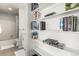 Charming bathroom with tiled shower and convenient built-in shelving at 11105 E Alameda Ave # 204, Aurora, CO 80012