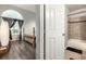 View of a bedroom and a tiled bathroom with a bathtub at 11105 E Alameda Ave # 204, Aurora, CO 80012