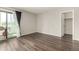 Well-lit bedroom featuring wood floors and sliding glass door leading to outdoor area at 11105 E Alameda Ave # 204, Aurora, CO 80012