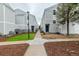 Exterior view of townhomes with well-maintained landscaping and walkways at 11105 E Alameda Ave # 204, Aurora, CO 80012