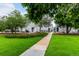 Well-maintained lawns and sidewalks provide a serene setting in this townhome community at 11105 E Alameda Ave # 204, Aurora, CO 80012