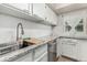 Beautiful kitchen with granite countertops, stainless steel sink, and stylish backsplash at 11105 E Alameda Ave # 204, Aurora, CO 80012
