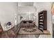 Spacious living room featuring dark wood floors, neutral walls, and a cozy seating area at 11105 E Alameda Ave # 204, Aurora, CO 80012