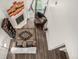 Aerial view of the living room with fireplace, rug, and a large sectional sofa at 11105 E Alameda Ave # 204, Aurora, CO 80012