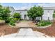 Charming outdoor patio with seating, barbecue grill, and beautiful landscaping for relaxing and entertaining at 11105 E Alameda Ave # 204, Aurora, CO 80012
