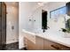 Modern bathroom featuring a sleek vanity with a quartz countertop and a walk-in shower at 2435 S Josephine St, Denver, CO 80210