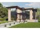 Modern two-story home with landscaped yard and attached garage at 2435 S Josephine St, Denver, CO 80210