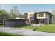 Contemporary home with a detached garage and a spacious backyard at 2435 S Josephine St, Denver, CO 80210