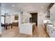 Modern kitchen with an island, wood floors, and stainless steel appliances at 2435 S Josephine St, Denver, CO 80210